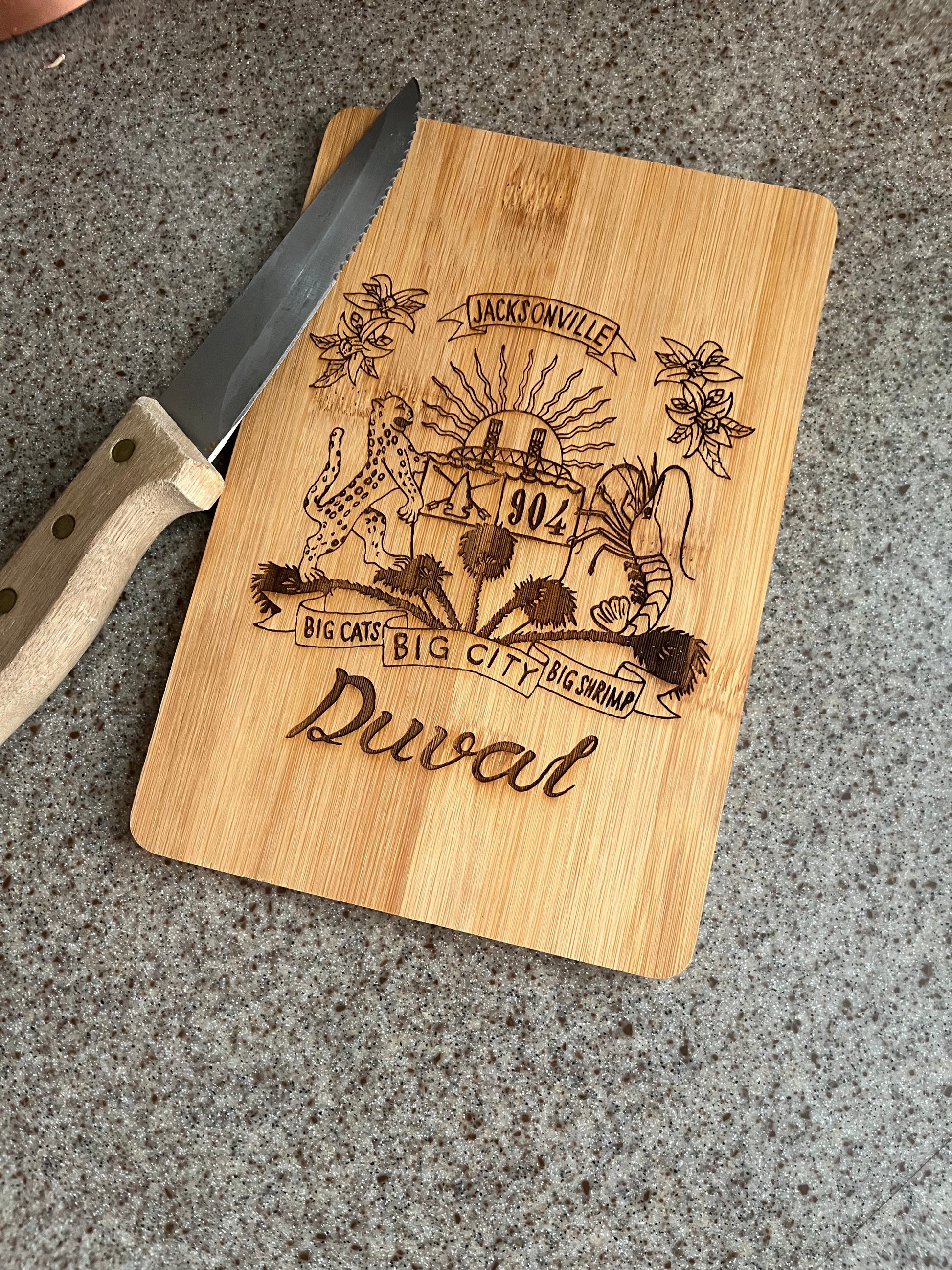 Duval Crest..... Join the Fam!   Show your 904 love with this mini cutting board  Material - wood  Size - 5 3/4" x 8 3/4 x 1/4"  This is great for picnics, boat outings, and camping trips