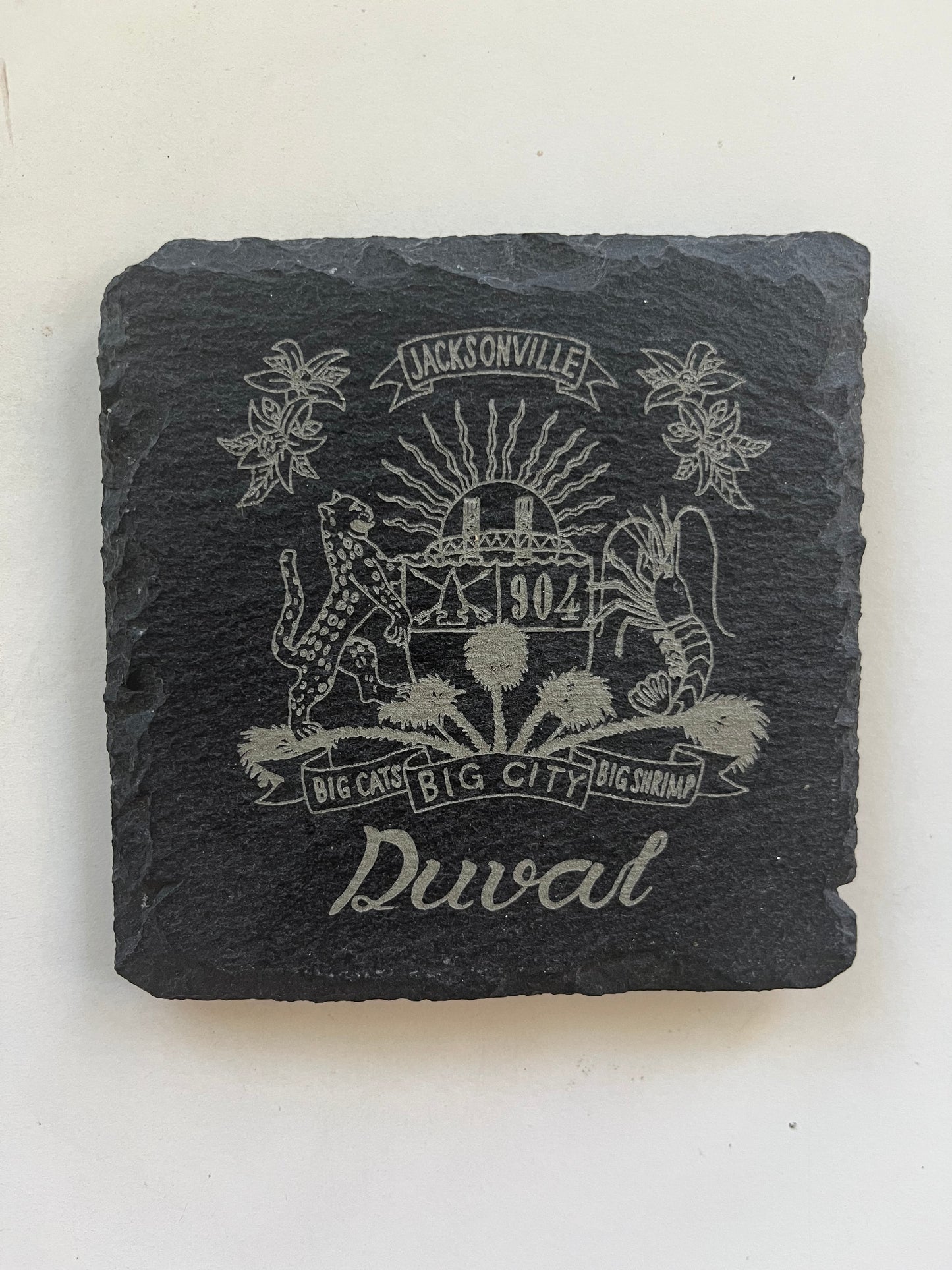 Duval Crest..... Join the Fam!&nbsp;  Show your 904 love around your home with these 4"x 4" slate coasters  &nbsp;About this Item Fashion design: These 100% all natural slate coasters fitting any color of dark tables and suits any kitchen theme, can make your home decoration full of personality. Table Safe: The square slate stone has a sturdy surface that can anti scratch and easy to clean, the bottom of the coaster have non-slip round mini soft mat provides stability. Perfect Size: Standard square size 4in