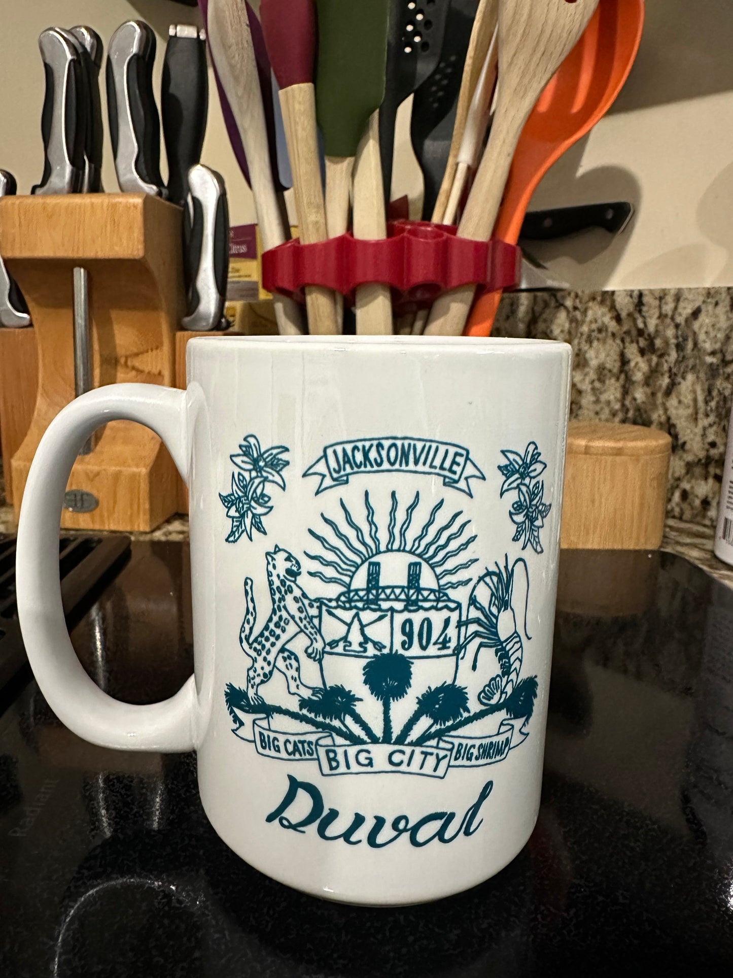 Duval Crest..... Join the Fam!&nbsp;  Show your 904 love &nbsp;each morning with&nbsp;Locally made XL white ceramic coffee mug&nbsp;  Microwave friendly -- Handle will not get super hot!  Comes in White with Black print or White with Teal Print &nbsp;- both sides of the handle